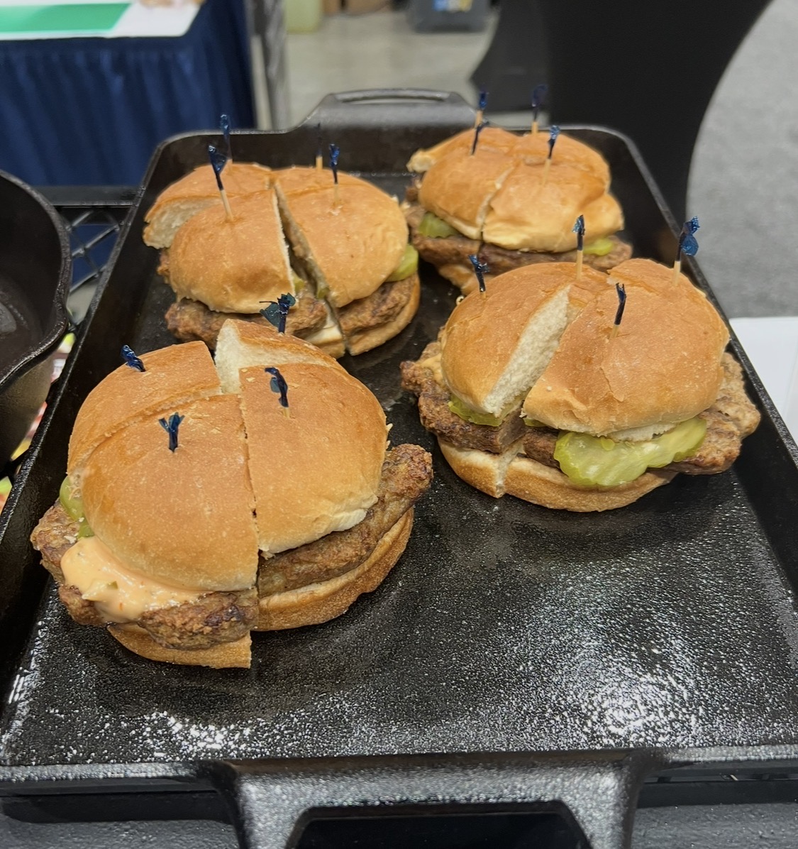 Texas Chili Company beef patty sliders on a cast-iron griddle